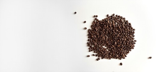 Coffee beans scattered on a white background, top view. Minimal banner template with empty space for text. Coffee background for advertising, cafe, restaurant, social media