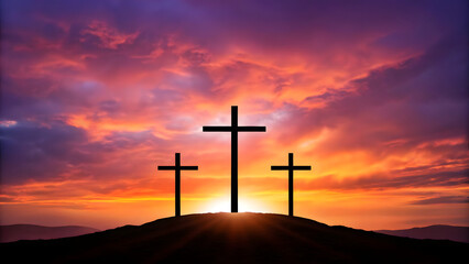 Three crosses on hill with sunset and colorful dramatic sky in christian faith scene
