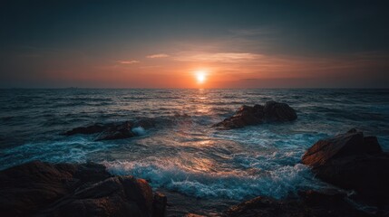 Dramatic coastal scene at sunset, featuring powerful waves crashing against dark rocks, with a vibrant orange sun setting over the vast expanse of the ocean.