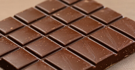 Fototapeta premium Chocolate Bar Close-up. Sweet Dessert Treat. Dark and Milk Chocolate.