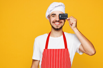 Young housewife housekeeper chef cook baker man wear red apron toque hat hold cover eye with mock...