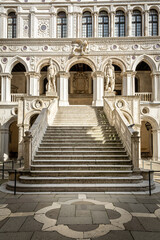 Grand marble staircase flanked by Mars Neptune statues at Doge Palace Venice