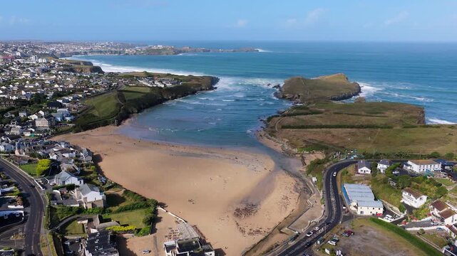Surf and waves Mawgan Porth north Cornwall England near Newquay and south of Porthcothan and Treyarnon on a summer day with blue sk