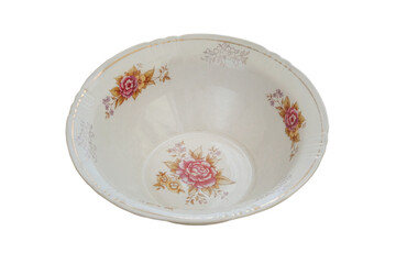 Plate with a pattern of flowers isolated on a white background. Ceramic tableware. Porcelain kitchenware.