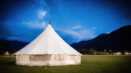 starlight. A cozy tent under a starry Milky Way sky creates a magical nightscape in the mountains. travel magazines, destination branding, designed for outdoor magazines and nature guides.