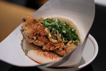 close up of a fried chicken sandwich bun Asian fusion food