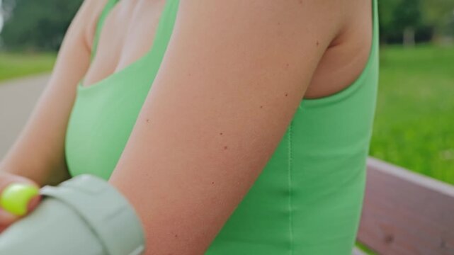 Wireless biosensor patch on woman&rsquo;s arm, future health data flow technology