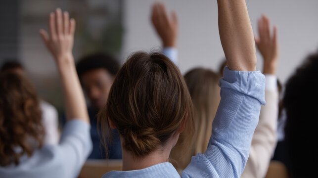 Curious minds unite as diverse attendees raise hands during World Philosophy Day, igniting intellectual sparks in dynamic symposium energy