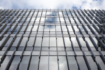 High quality shot of modern building facade with sleek lines, ideal for architectural advertising, real estate projects, and branding materials highlighting contemporary urban living