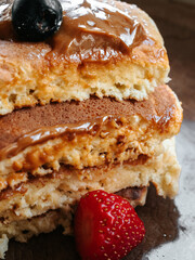 Pancakes with berries and chocolate sauce