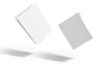 Two blank, slightly angled brochures float against a white background, casting subtle shadows.  One is brighter white, the other a lighter gray