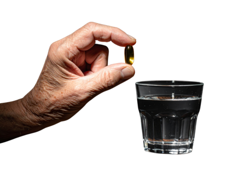 Senior Man Taking Fish Oil Capsule for Heart Health