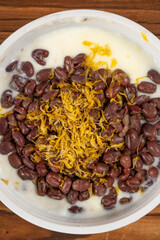 top view chrysanthemum and red bean double-skin milk at vertical composition