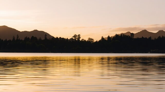 shore. Tranquil lakeside view at sunset with calm water reflecting golden hues. inspiring travel planning, travel magazines, designed for outdoor magazines and nature guides.