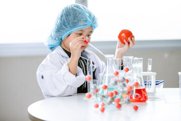 Asian little cute girl students. Girl doing science experiment science classroom.. Education research and development concept learning kids.