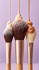 Makeup brushes with dripping foundation shades on pastel background