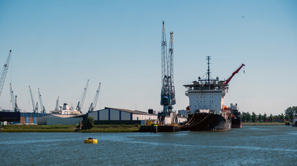 Port of Rotterdam, Netherlands. Cargo ships and cranes loading, Logistics business