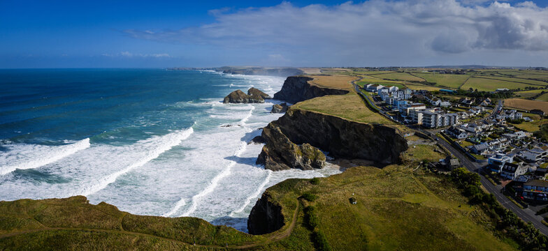 Surf and waves Mawgan Porth north Cornwall England near Newquay and south of Porthcothan and Treyarnon on a summer day with blue sk