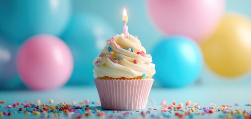 The delicious cupcake with a candle amidst colorful balloons celebrating joyfulness.