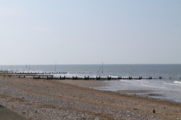 The Breakwater Groynes on a Stony Seaside Beach.