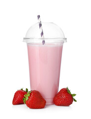Tasty strawberry milkshake in plastic cup and fresh fruits isolated on white