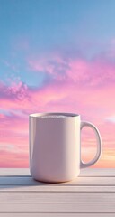 Obraz premium A white mug of coffee on a wooden table against a vibrant pink and blue sunrise/sunset sky