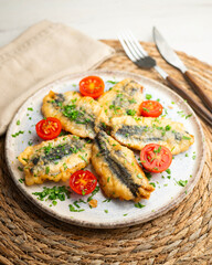 Spanish tapa of breaded anchovies in Malaga, Spain.