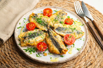 Spanish tapa of breaded anchovies in Malaga, Spain.