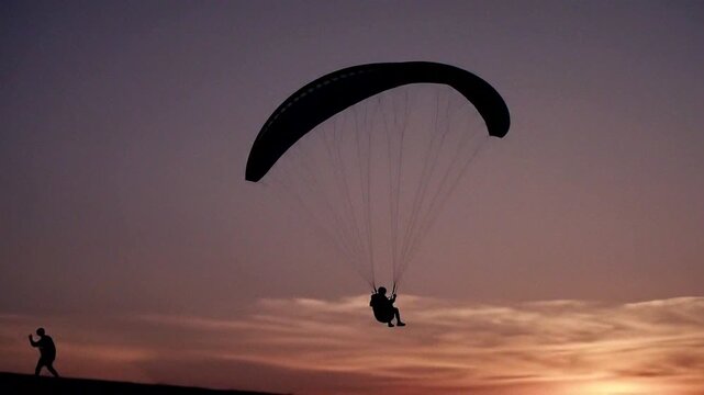 Experience the thrill of paragliding against a stunning sunset backdrop, capturing the essence of adventure and freedom.