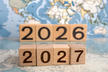 Wooden Blocks Transition from 2026 to 2027 on World Map Background