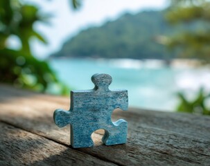 A single light blue jigsaw puzzle piece sits on a weathered wooden surface, blurred tropical scenery in the background