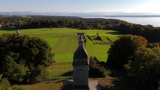 Top drone view of Bavarian landscape near Starnberger See with Bismarck tower Assenhausen. Historic architecture, german heritage monument and scenic cultural tourism.