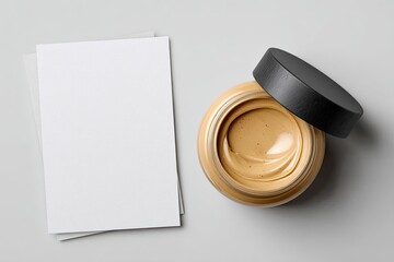 Light beige face cream in a glass jar, with blank cards