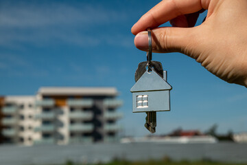 First-Time Homebuyer – Woman with Keys and House Keychain