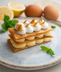 Millefeuille filled with lemon curd and meringue.
