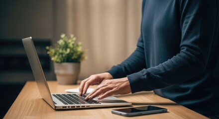 woman typing on laptop