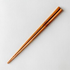 Light brown wooden chopsticks, angled on a plain white background