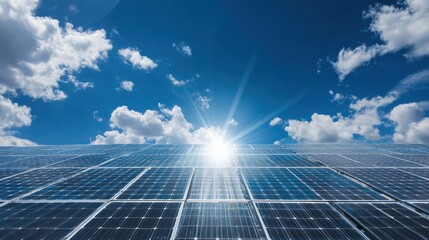Bright Solar Panels Under a Clear Blue Sky with Sunlight Rays
