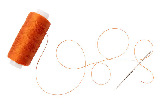 Old spool of thread and needle on a white background. Sewing accessories