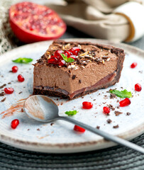 Chocolate mousse cake with red berries, blueberries, and raspberries.