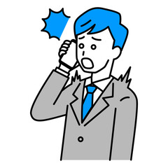 スマートフォンでの通話で驚くスーツの男性