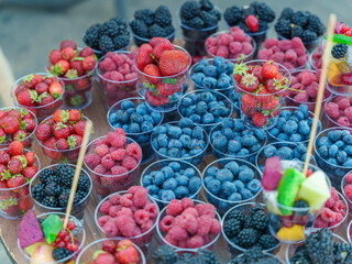 Colorful Assortment of Fresh Berries in Plastic Cups