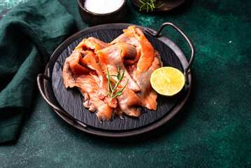 Salted sliced salmon fish with herbs