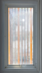 Fototapeta premium Window pane with broken and cracked glass.