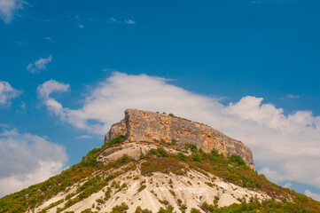 Rural landscape with mountain at summer on blue sky background