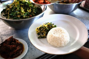 Delicious Indonesian Cuisine A Plate of Rice with Vegetable Side Dishes