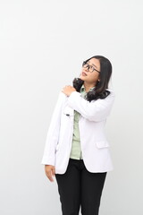 Asian female doctor suffering a shoulder pain. Isolated on white background
