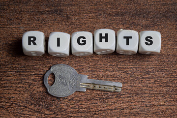 Rights on stacked wooden cubes on the table. Representing freedom and equality. Business and finance concept