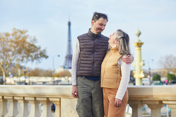 Happy romantic couple spending time together on a fall day in Paris, France