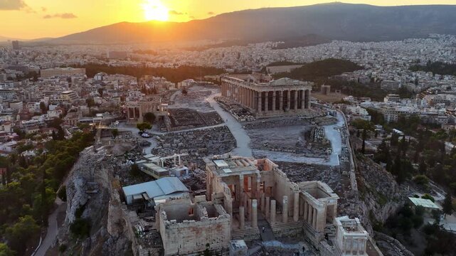 Drone shot of Iconic Parthenon and Ancient Ruins in Athens, Greece at sunrise. Aerial View of Athens Ancient Acropolis, travel in Greece